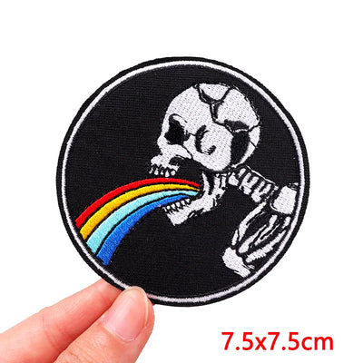 Patch with skeleton eating a rainbow held by a hand, size 7.5x7.5cm.