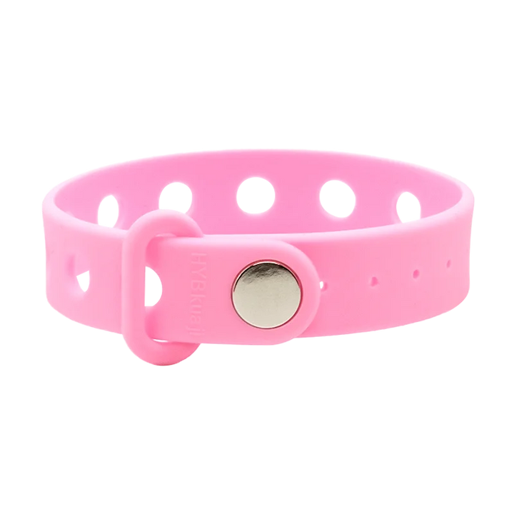Pink wrist band with a metal buckle on a white background