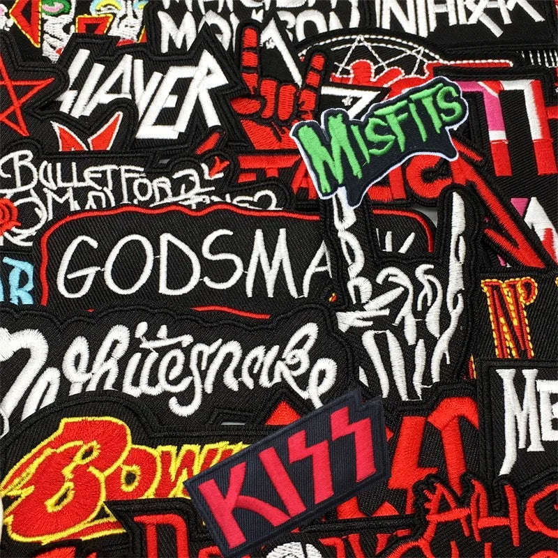 Collection of various band patches with prominent text on a black background