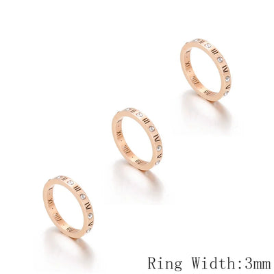 Three rose gold rings with engraved designs on a white background