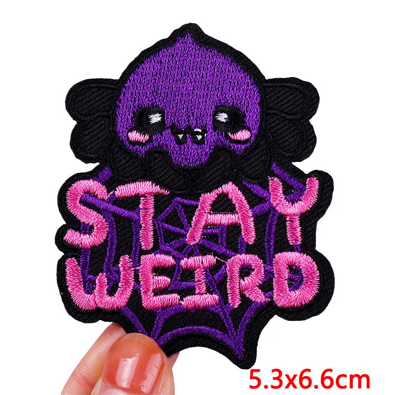 Embroidered patch with a purple skull and &