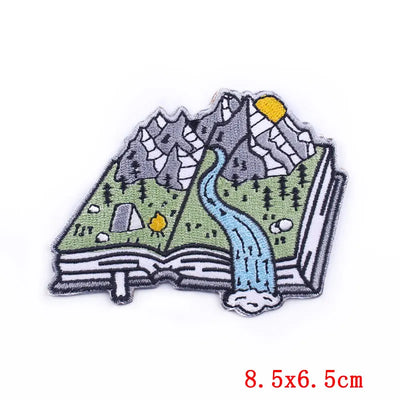 Embroidered patch of a map with mountains and a river on a white background