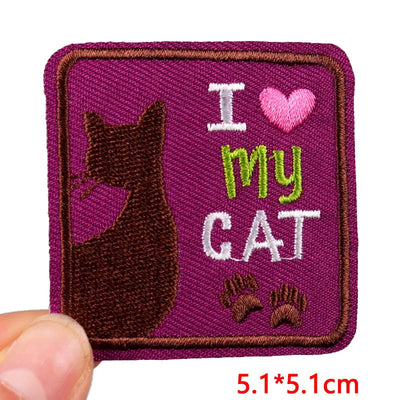 Embroidered patch with 'I ❤️ my cat' text and a cat silhouette on a purple background.