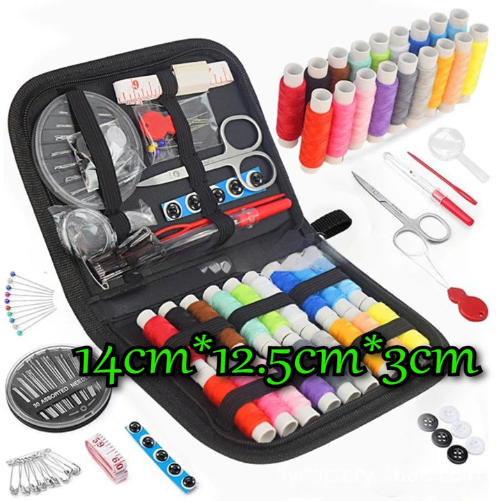 Sewing kit with various tools and threads on a white background