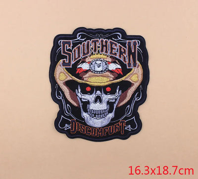 Embroidered patch with skull design and text on a beige background