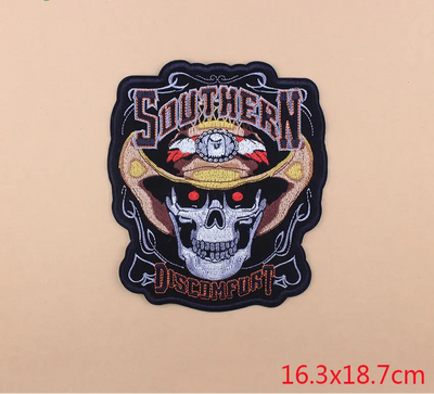 Embroidered patch with skull design and text on a beige background