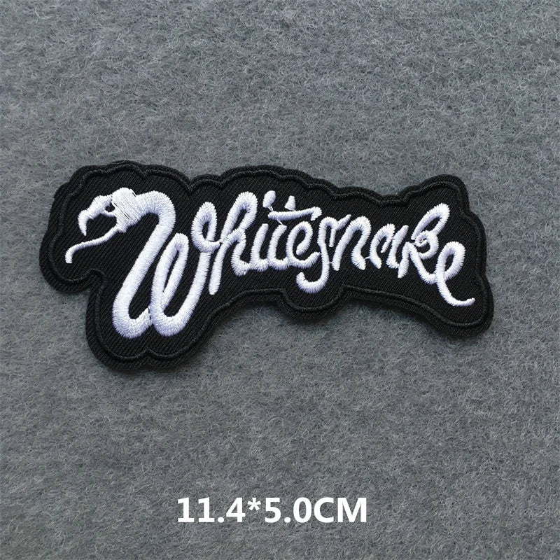 Embroidered patch with 'Whitesnake' text on a gray background