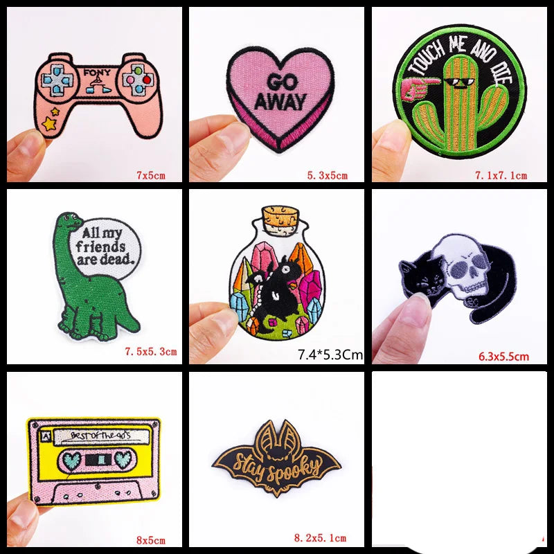 Collection of various patches with different designs and text, displayed against a white background.