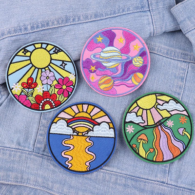 Four colorful patches on a denim jacket