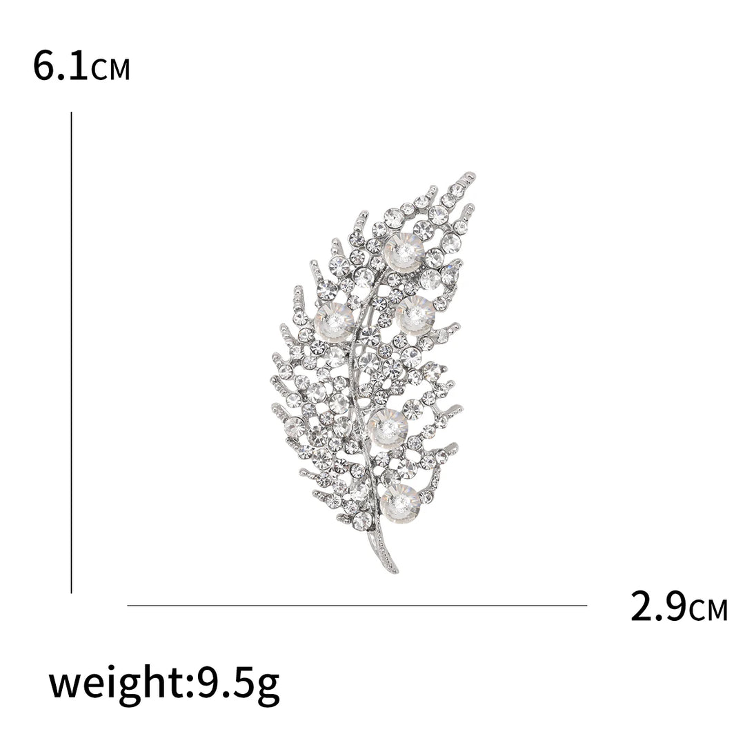 Decorative brooch with measurements and weight on a white background