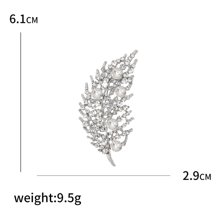 Decorative brooch with measurements and weight on a white background