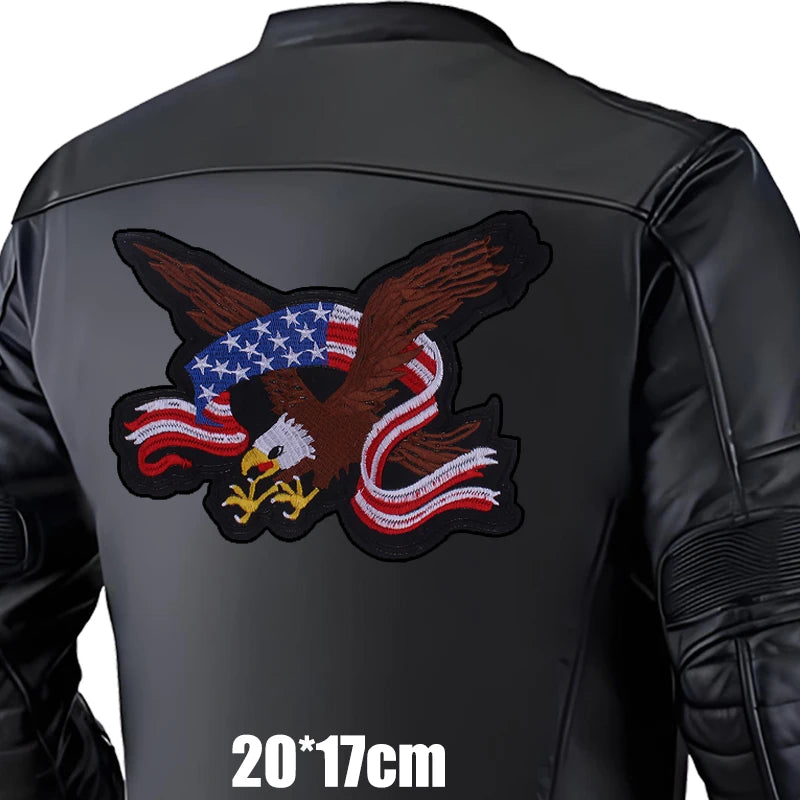 Black leather jacket with an eagle and American flag patch on a white background