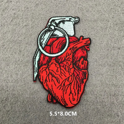 Heart-shaped grenade patch on a gray background