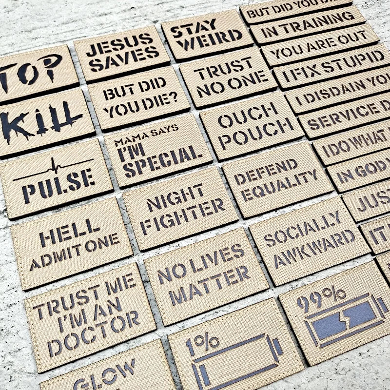 Collection of motivational and humorous text patches on a textured surface