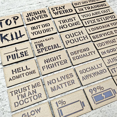Collection of motivational and humorous text patches on a textured surface