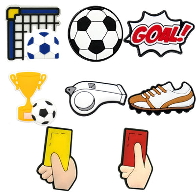 Set of soccer-themed shoe charms including a ball, goal, trophy, whistle, and cards on a white background.