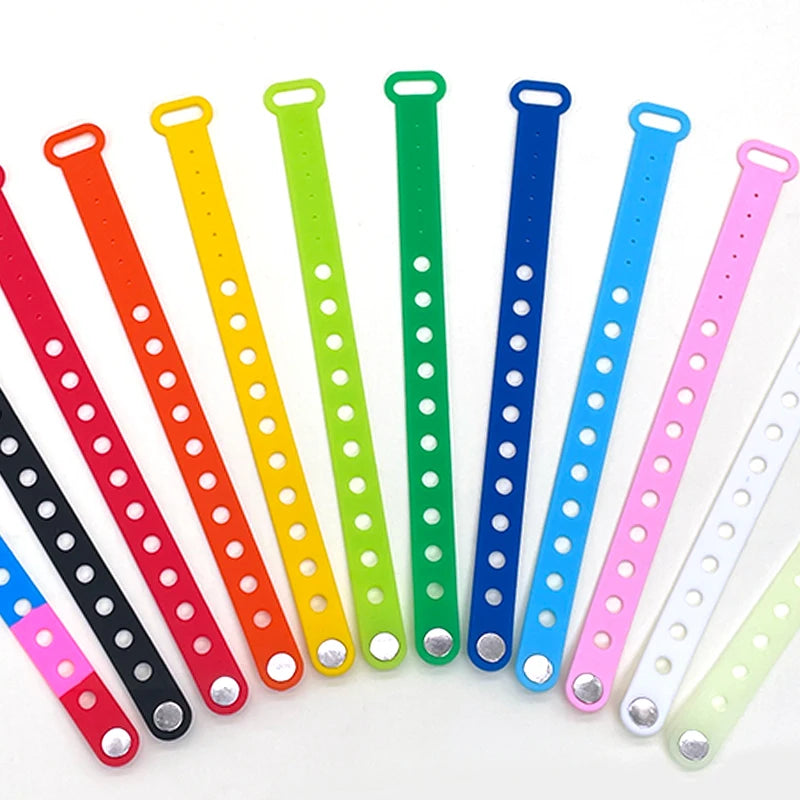 Colorful silicone wristbands with holes on a white background