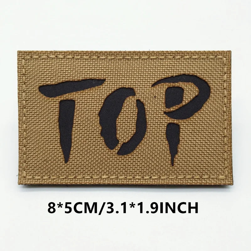 Rectangular doormat with 'TOP?' text on a white background