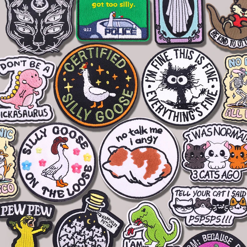 Collection of various colorful patches with different designs and text.