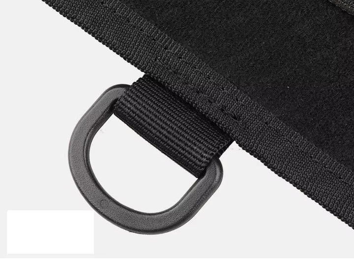Close-up of black patch display boards showing edges and the plastic hook attached on a white background