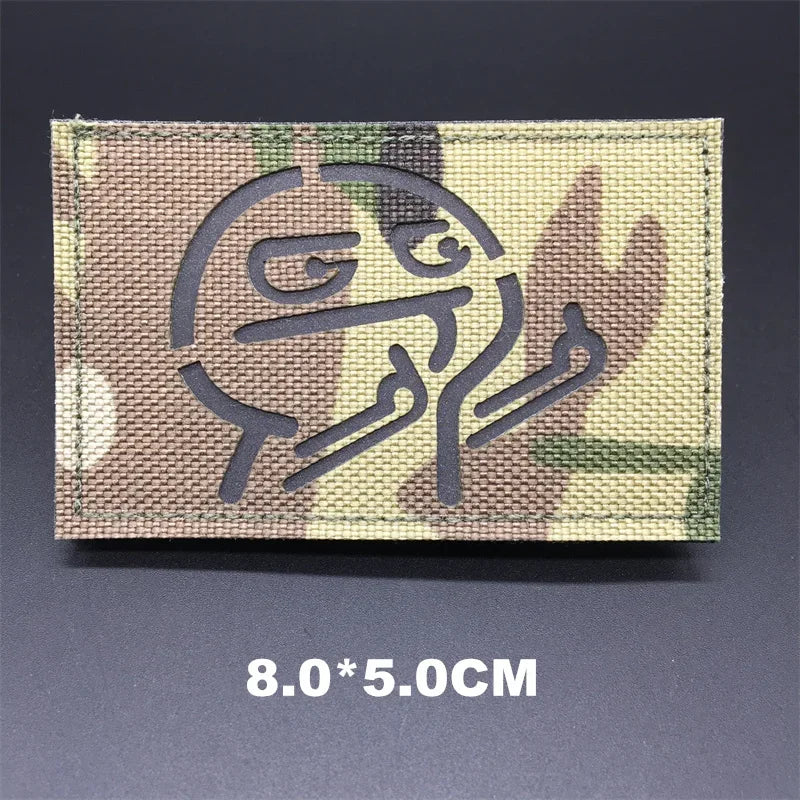 Multicam patch with a logo on a dark background