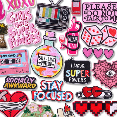 Collection of colorful patches with various designs and text.