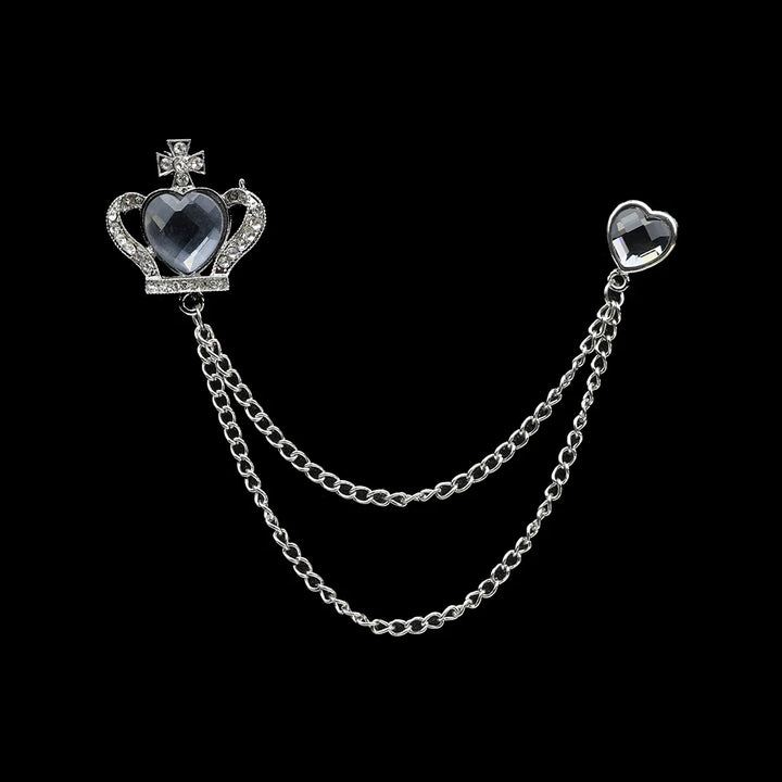 Jewelry piece with heart-shaped elements and a chain on a black background
