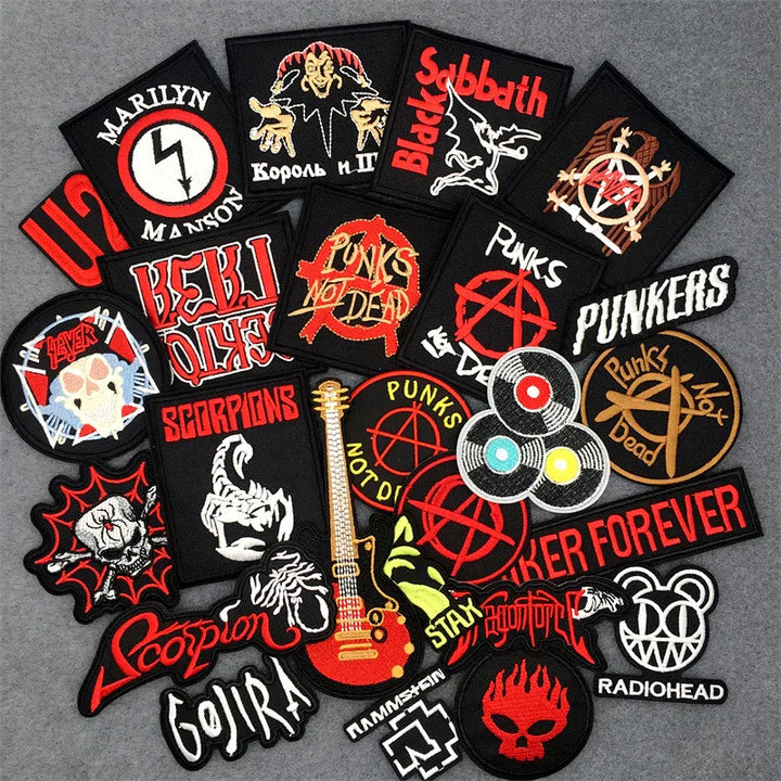 Collection of music-themed patches on a gray background
