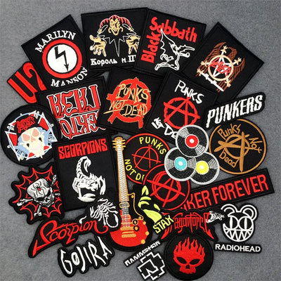 Collection of music-themed patches on a gray background