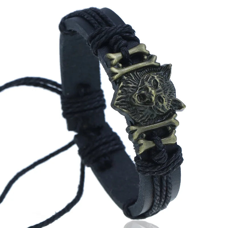 Black braided bracelet with a wolf head charm on a white background