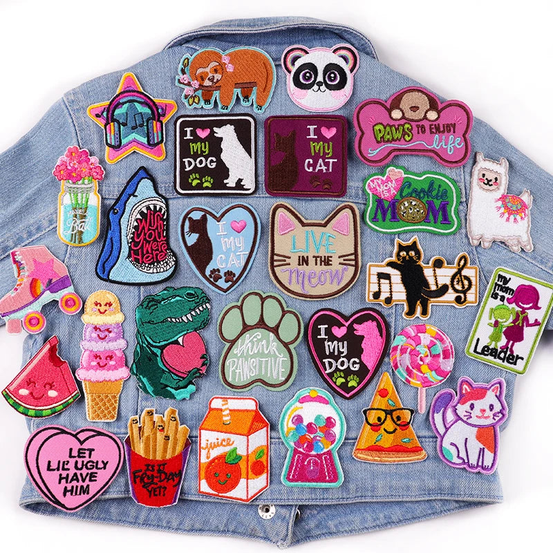 Denim jacket with various colorful patches on a white background