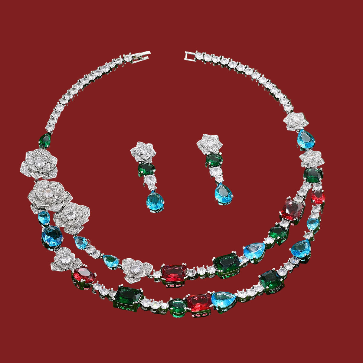 Jewelry set with necklace and earrings on a red background