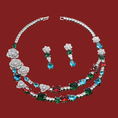 Jewelry set with necklace and earrings on a red background