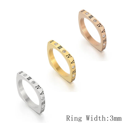 Three rings in gold, silver, and rose gold with Roman numeral design on a white background.