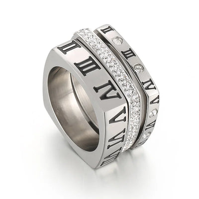 Silver ring with Roman numeral design on a white background