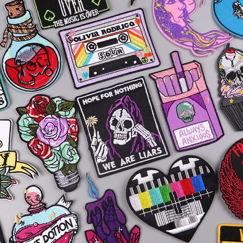 Collection of various colorful patches with different designs on a gray background