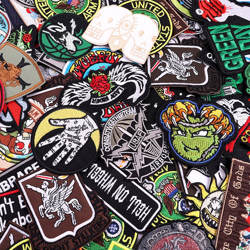 Collection of various colorful patches with different designs and text.