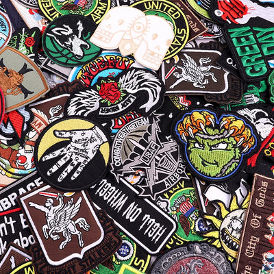 Collection of various colorful patches with different designs and text.