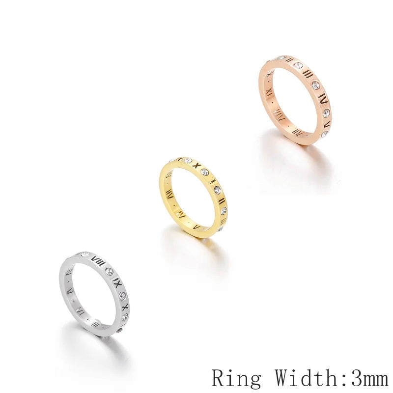 Three rings in gold, silver, and rose gold on a white background