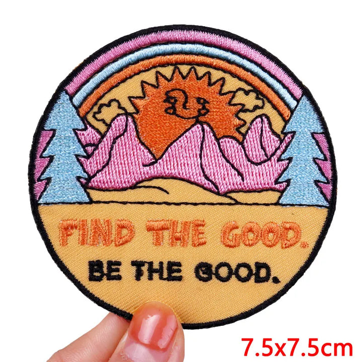 Circular patch with nature design and motivational text held by a hand, size 7.5x7.5cm.