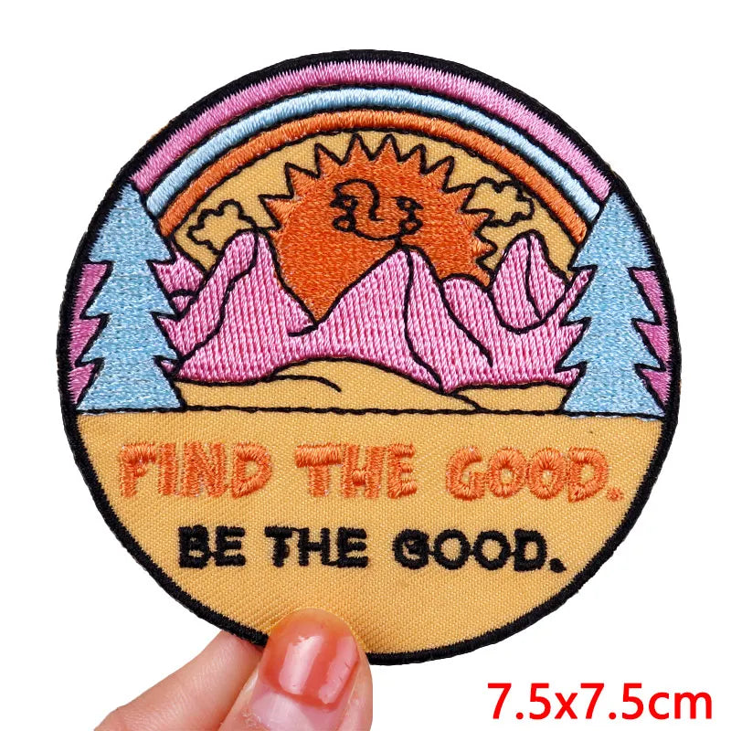 Circular patch with nature design and motivational text held by a hand, size 7.5x7.5cm.