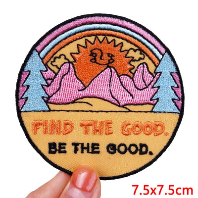 Circular patch with nature design and motivational text held by a hand, size 7.5x7.5cm.