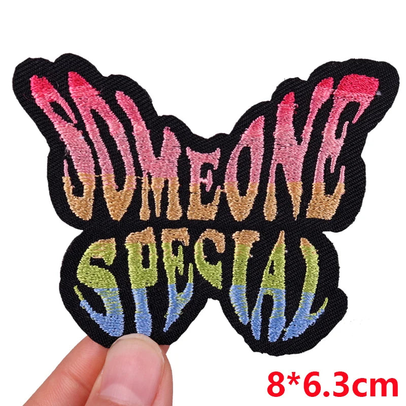 Colorful patch with 'SOMEONE SPECIAL' text held by a hand, size 8*6.3cm.