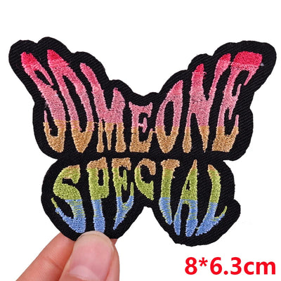 Colorful patch with 'SOMEONE SPECIAL' text held by a hand, size 8*6.3cm.