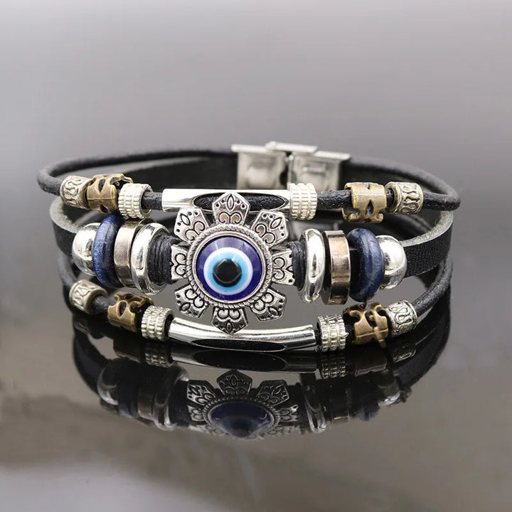 Multistrand bracelet with decorative beads on a reflective surface