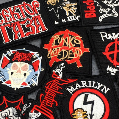 Collection of various punk-themed patches with bold text and graphics.