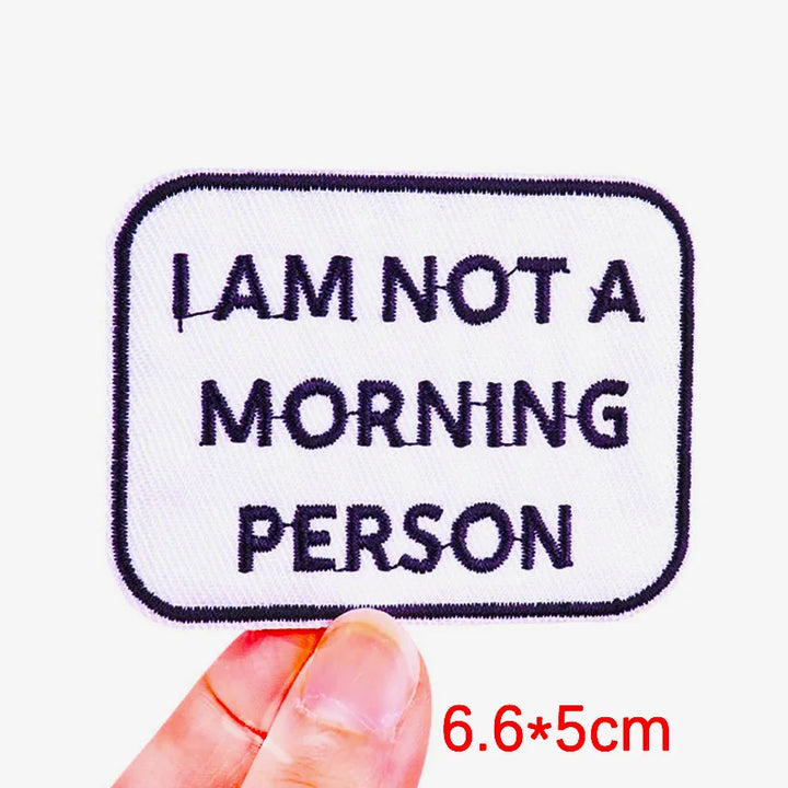 Embroidered patch with &