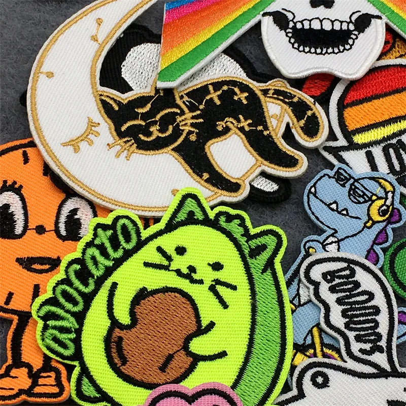 Collection of colorful patches with various designs on a dark background