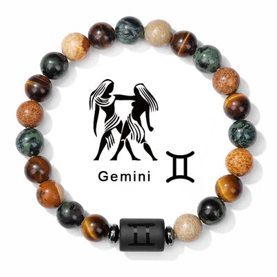 Bracelet with gemstone beads and Gemini zodiac symbol on a white background