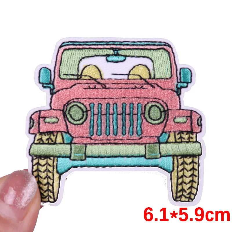 Colorful cartoon-style jeep patch held by a hand with dimensions displayed.